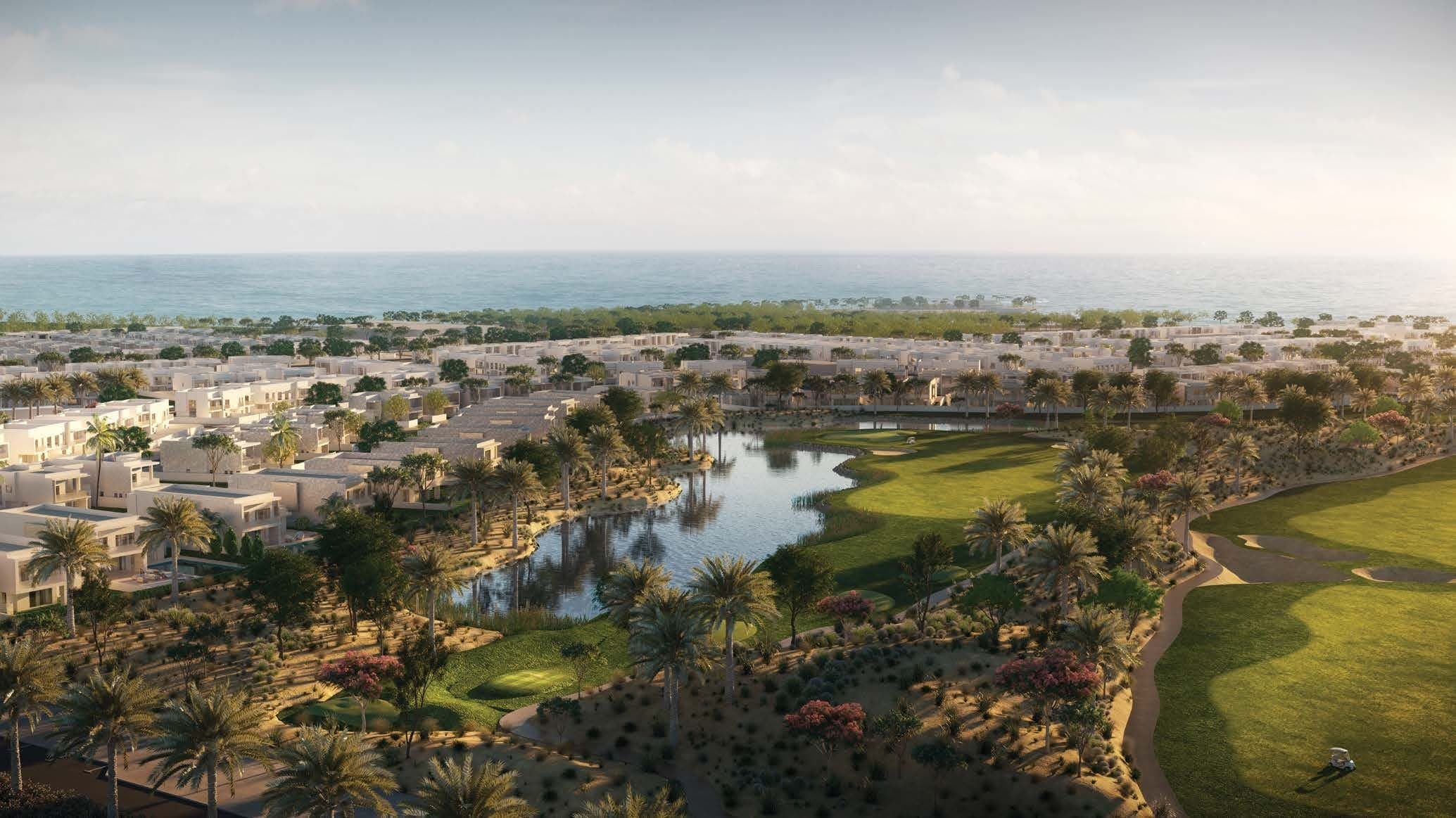 The Orchids at Yas Acres — aerial over the golf course, lakes and waterfront homes